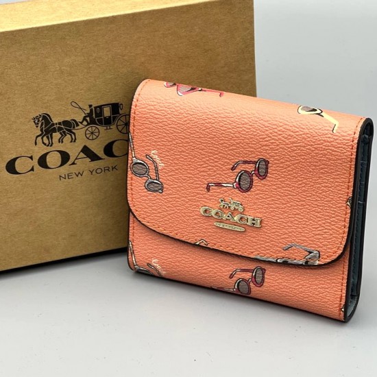 Кошелек Coach с ярким принтом